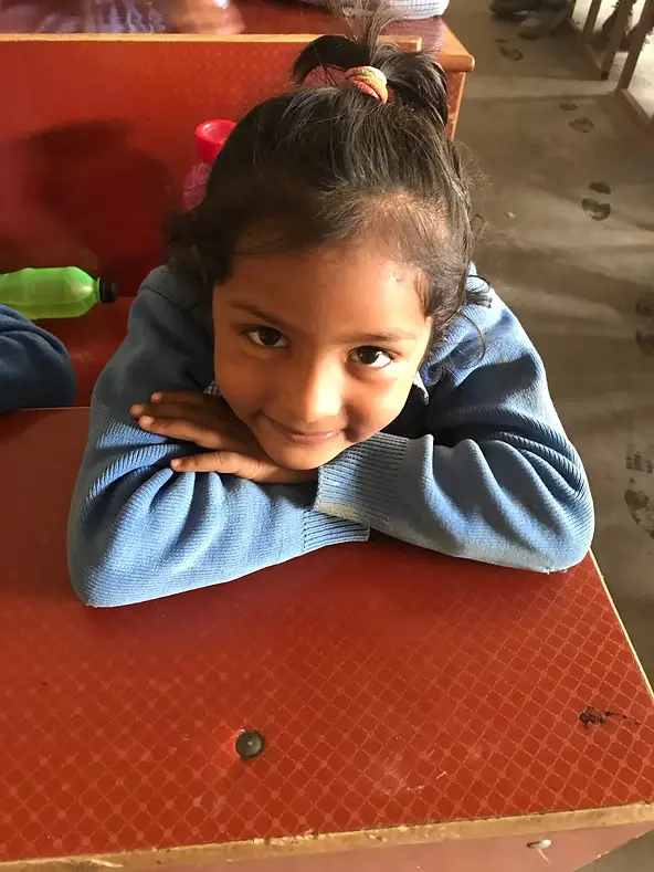 Smiling student at GMV School in India,